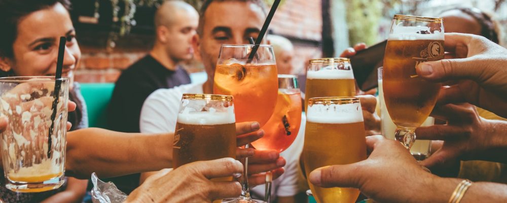 people holding drinks during day