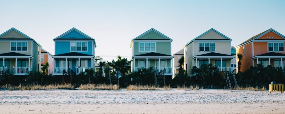 five assorted-color 2-storey houses