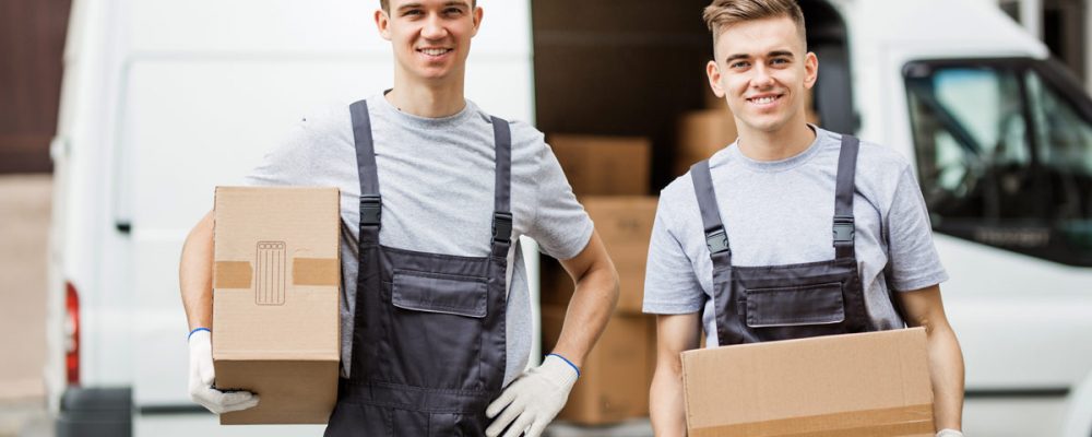 two-young-handsome-smiling-workers-wearing-uniform-XCRPUA8